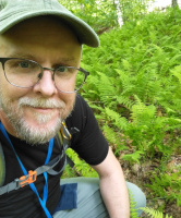 Aaron surrounded by ferns